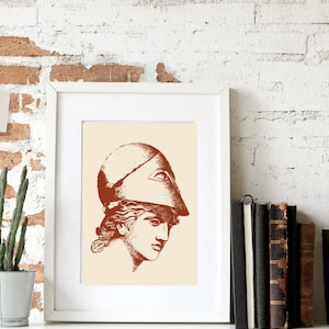 May include: A framed print of a line drawing of a woman's head wearing a helmet. The drawing is in shades of brown on a cream background.