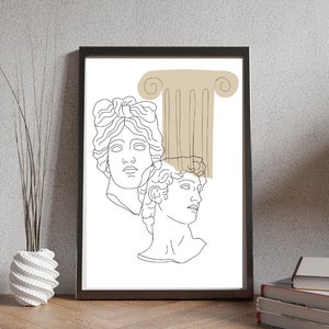 May include: Line art print of two classical busts with a beige column behind them. The print is framed in black.