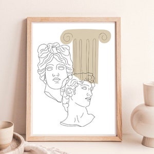 May include: Line art print of two classical busts with a beige column behind them. The print is framed in a light wood frame.