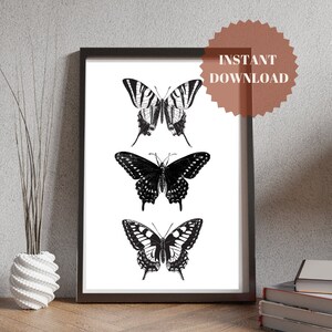 May include: A printable art print featuring three black and white butterfly illustrations. The butterflies are arranged vertically, with the top butterfly having striped wings and the bottom two butterflies having solid wings.