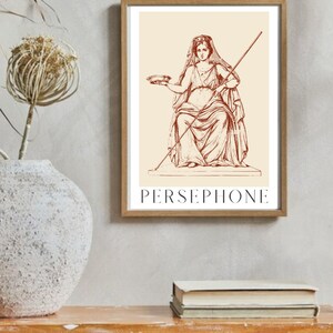 May include: A vintage illustration of Persephone, the Greek goddess of spring, in a seated pose. She is holding a bowl in her left hand and a staff in her right hand. The image is in brown and white on a cream background.