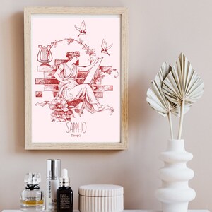 May include: A red and white illustration of Sappho, a Greek poet, sitting on a brick wall with a lyre and birds flying around her. The text "Sappho" and "&Sigma;&alpha;&pi;&phi;ώ" is below the illustration.