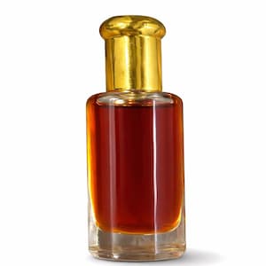 May include: A small, clear glass perfume bottle filled with a dark amber liquid. The bottle has a gold-coloured cap and a rectangular base. The perfume bottle is isolated on a white background.