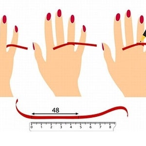 May include: A diagram showing how to measure your ring size using a piece of string. The string is wrapped around the base of your finger and then measured against a ruler. The measurement is 48 mm.