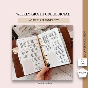 May include: A weekly gratitude journal planner insert with a white background and black text. The planner insert is designed for use in a A5 ring planner. The planner insert has a section for writing down things you are grateful for each day of the week. The planner insert also has a section for writing down your weekly goals.