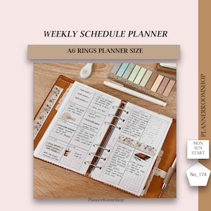 May include: A brown leather A6 planner with rings, open to a weekly schedule page. The planner has a tabbed divider and a clear plastic pocket on the front cover. The page is filled with handwritten notes and stickers.