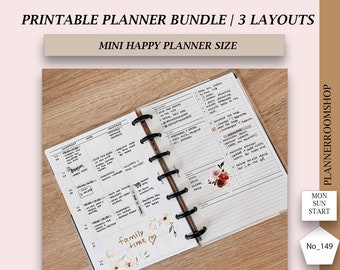 May include: A printable planner bundle with three different layouts in mini happy planner size. The planner pages are open to show the weekly layout with a floral sticker and the text "family time".