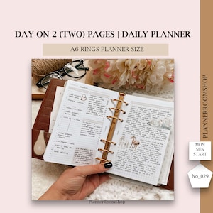 May include: A brown A6 ring planner open to two pages of a daily planner. The planner is held open by a hand. The text on the top of the image reads "DAY ON 2 (TWO) PAGES | DAILY PLANNER" and "A6 RINGS PLANNER SIZE". The planner has gold rings and the text "PlannerRoomShop".