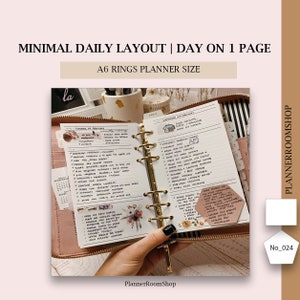 May include: An open A6 rings planner with a daily layout on one page. The white paper features black handwritten text, checklists, and floral stickers. The planner has a gold metal ring mechanism and is encased in a pink zippered cover.