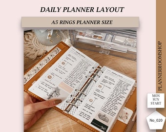 May include: A close-up of an open A5 planner with a brown leather cover. The planner has a daily layout with sections for "Morning", "Afternoon", and "Evening". The planner is decorated with stickers and washi tape. The text "PlannerRoomShop" is visible on the bottom of the page.