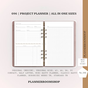 May include: A project planner with a pink cover and silver binder rings. The planner pages feature sections for project details, action steps, and a grid for notes. Text on the planner reads "096 | PROJECT PLANNER | ALL IN ONE SIZES".