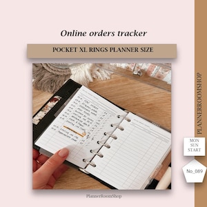 May include: A black Pocket XL rings planner open to a page with a list of online orders. The planner has silver rings and a white paper insert. The text "Online orders tracker" and "POCKET XL RINGS PLANNER SIZE" are at the top.