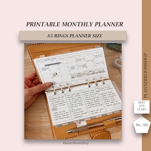May include: A close-up of a brown leather A5 planner with a white monthly planner insert. The planner is open to January 2024 and has a handwritten to-do list on the right page. The planner has six rings and a silver pen is lying on top of it.