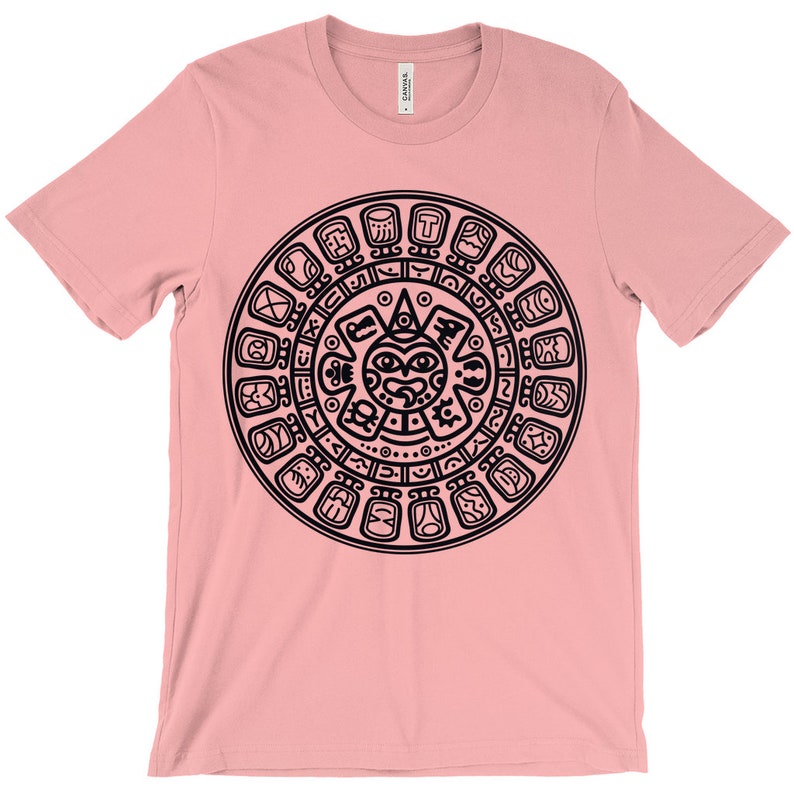 May include: A pink t-shirt with a black graphic of the Aztec calendar, a circular design with glyphs and a central sun face.