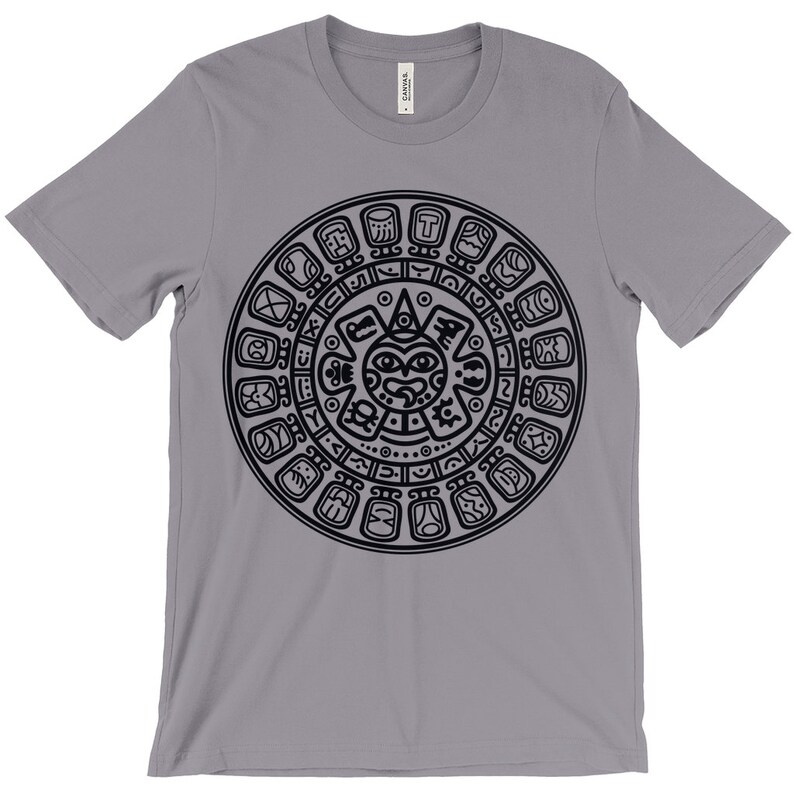May include: A gray t-shirt with a black Aztec calendar design printed on the front.