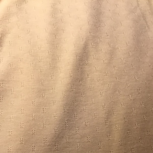 Light pink/peach cotton/poly knit fabric