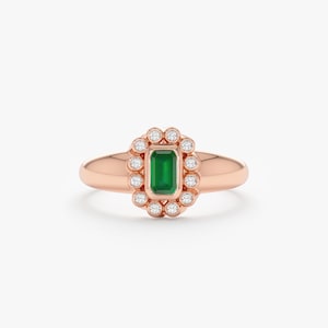 emerald ring with diamond halo in rose gold