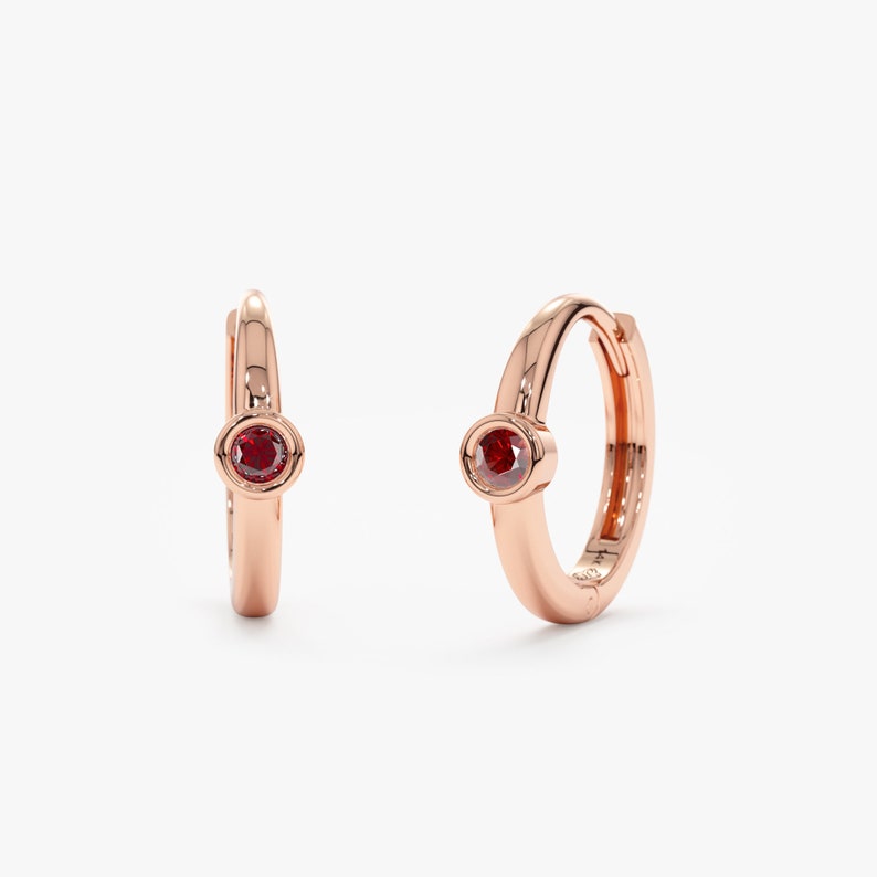 garnet bezel huggie in rose gold