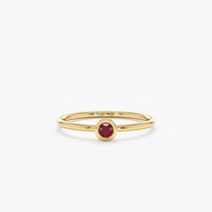 july birthstone red ruby ring in yellow gold