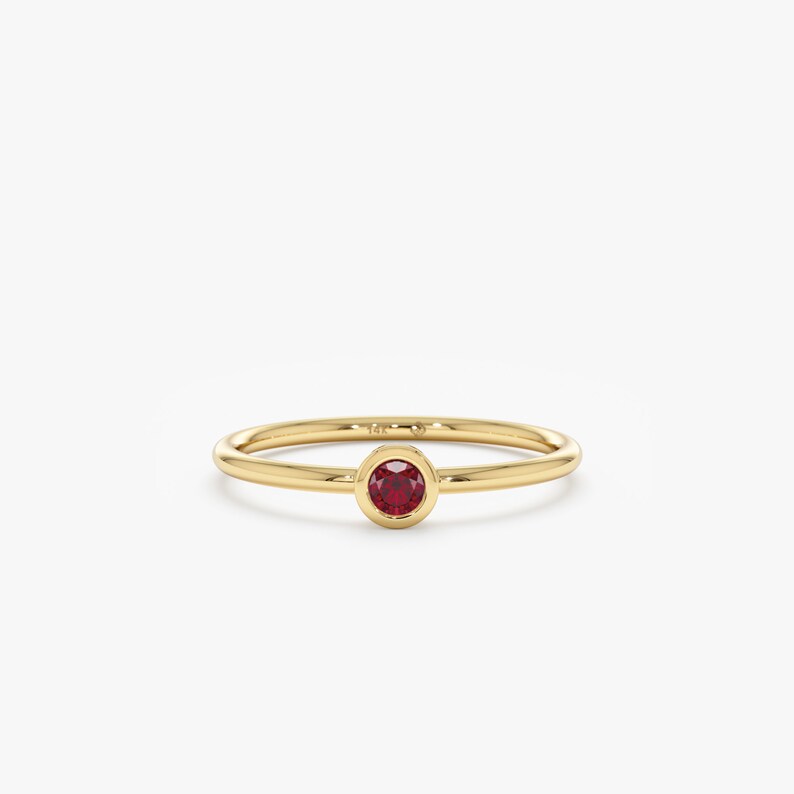 july birthstone red ruby ring in yellow gold