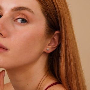 model wearing petite classic diamond stud earrings