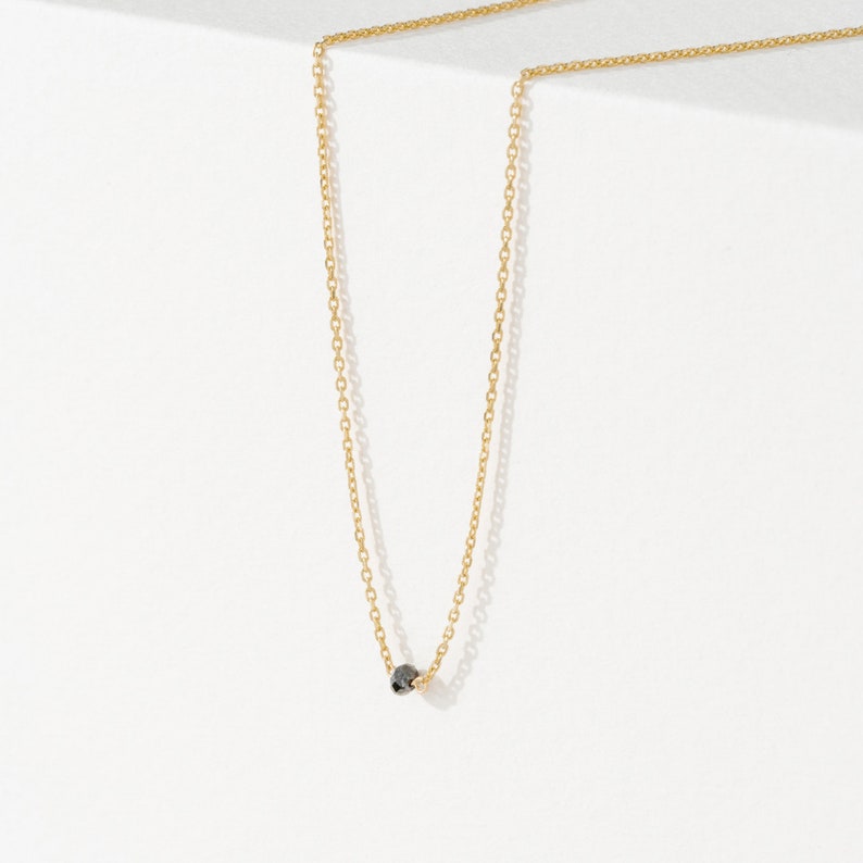 14k gold necklace with single black diamond