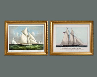 May include: Two framed prints of vintage sailing ships. The left print shows a white sailboat with a green sea in the background. The right print shows a white sailboat with a red flag and the text "Schooner Yacht Carola, 100 Tons".