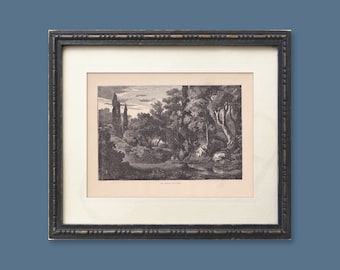 May include: A black and white framed print of a landscape scene with trees and a river. The print is titled "In the Woods".