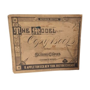 May include: The cover of a vintage copybook titled "The Model Copy Book" with "Sliding Copies" and "Goodman's Patent" printed below. The book is published by D. Appleton & Co. in New York, Boston, and Chicago.