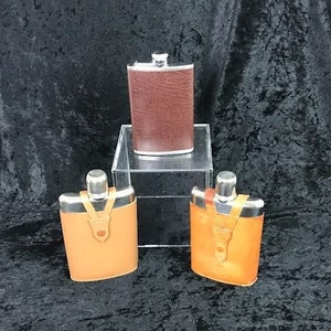 Vintage Set of Three Leather Wrapped Hip Flasks