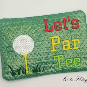 May include: Green quilted fabric with embroidered golf ball, grass, and the text "Let's Par Tee".