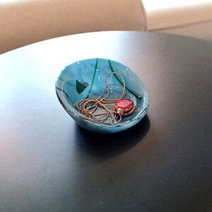 Asymmetrical blue and green glass jewelry dish. Fused glass. Salt pinch bowl. 3 1/2 inches in diameter. RedQueenArtGlass.