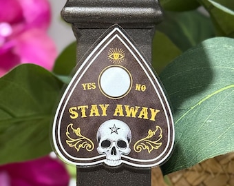 Manténgase alejado del imán de nevera de la planchette