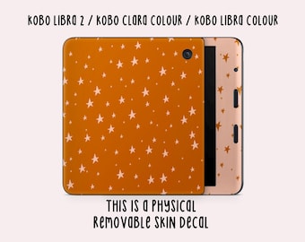 Könnte beinhalten: Ein abnehmbarer Skin-Aufkleber für die E-Reader Kobo Libra 2, Kobo Clara Colour und Kobo Libra Colour. Der Aufkleber zeigt ein Muster aus weißen Sternen auf orangefarbenem Hintergrund.