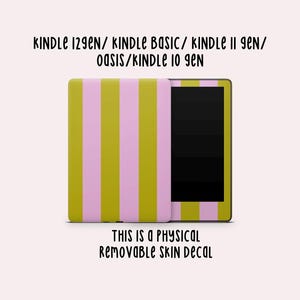 May include: A Kindle skin decal with a vertical striped pattern in olive green and light pink. The text at the top reads "KINDLE 129EN/ KINDLE BASIC/ KINDLE II GEN/ OASIS/ KINDLE 10 GEN". The text at the bottom reads "THIS IS A PHYSICAL REMOVABLE SKIN DECAL".