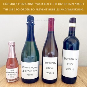 May include: Four glass bottles of varying sizes with white labels. The labels display text: mini champagne 3.25"x2", Champagne 4.25"x3.25", Burgundy 3.5"x4", and Bordeaux 4"x5". The top text reads: CONSIDER MEASURING YOUR BOTTLE IF UNCERTAIN ABOUT THE SIZE TO ORDER TO PREVENT BUBBLES AND WRINKLING.
