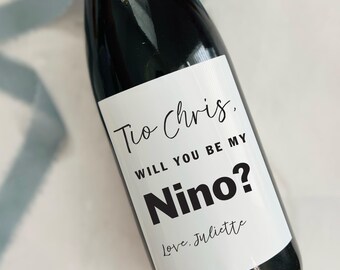May include: A 750ml wine bottle with a white label that says "Tio Chris. WILL YOU BE MY Nino? Love, Juliette".