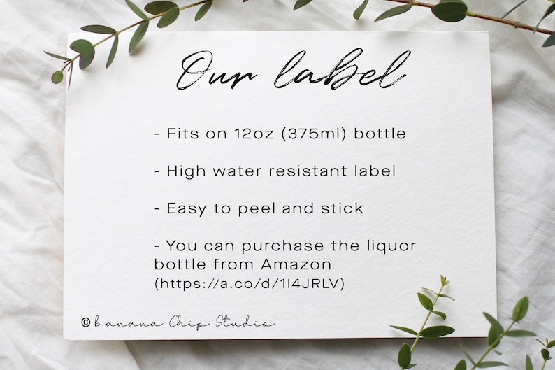 May include: A white card with the text "Our label" in elegant script. The card lists features: fits a 355ml bottle, high water resistance, and easy peel and stick. The card also mentions purchasing the liquor bottle from Amazon.