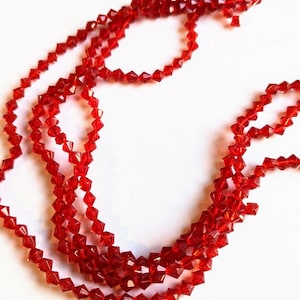 Translucent Red Glass Faceted Bicones