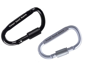May include: Two metal carabiners with a silver and black finish. Both carabiners have the text "Your text here" engraved on them.