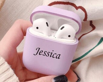 May include: A lavender silicone case for wireless earbuds with the name "Jessica" printed on the front.