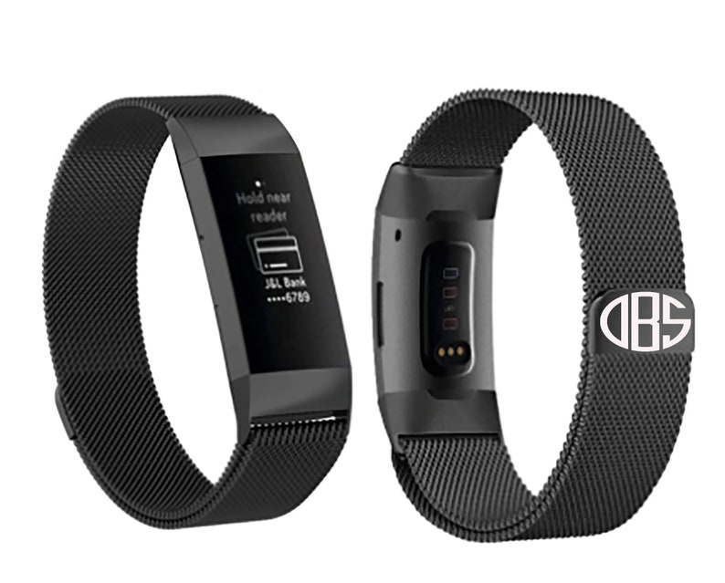 May include: Black metal band for a Fitbit smartwatch with a monogrammed buckle that says "DBS".
