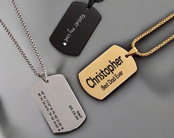 May include: Three silver dog tag necklaces with different engravings. The first tag reads "Forever my Love" with a heart symbol. The second tag reads "Christopher Best Dad Ever". The third tag has coordinates and the text "G&T 03.15.24".