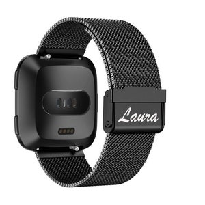 May include: Black smartwatch with a mesh band. The watch face is square with rounded corners. The band has a magnetic clasp with the name "Laura" in white script. The watch is designed for fitness tracking and notifications.