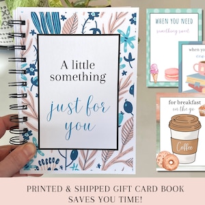 May include: A spiral bound notebook with a floral design on the cover. The cover has the text "A little something just for you". The notebook is a gift card book that is printed and shipped.