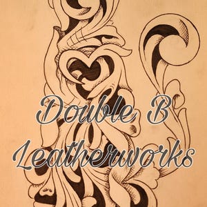 May include: A hand-drawn illustration on tan paper featuring a stylized floral design with a heart-shaped element. The design is outlined in black ink, with the text "Double B Leatherworks" in cursive script.