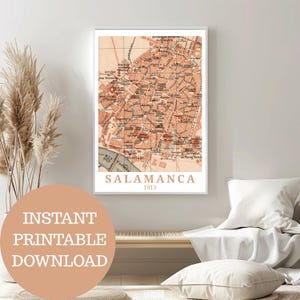May include: A framed vintage map of Salamanca, Spain, from 1913, in shades of peach and brown. The map is detailed with streets and landmarks. Text at the bottom reads "SALAMANCA 1913". A circular graphic with the text "INSTANT PRINTABLE DOWNLOAD" is in the foreground.
