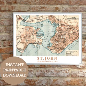May include: A framed vintage map of St. John, New Brunswick, from 1922, with a detailed illustration of the city's layout. The map is in shades of brown and blue, with text that reads "ST. JOHN, NEW BRUNSWICK, 1922" and "INSTANT PRINTABLE DOWNLOAD".