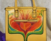 Beautiful, brand new, yellow leather hand bag, hand-painted with a bold red floral motif