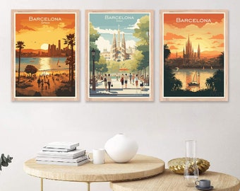May include: Three framed art prints featuring Barcelona, Spain, cityscapes. Each print showcases a different view: a beach scene at sunset, a park with a cathedral, and a waterfront with a church. The prints have a warm color palette with orange, yellow, and brown tones.